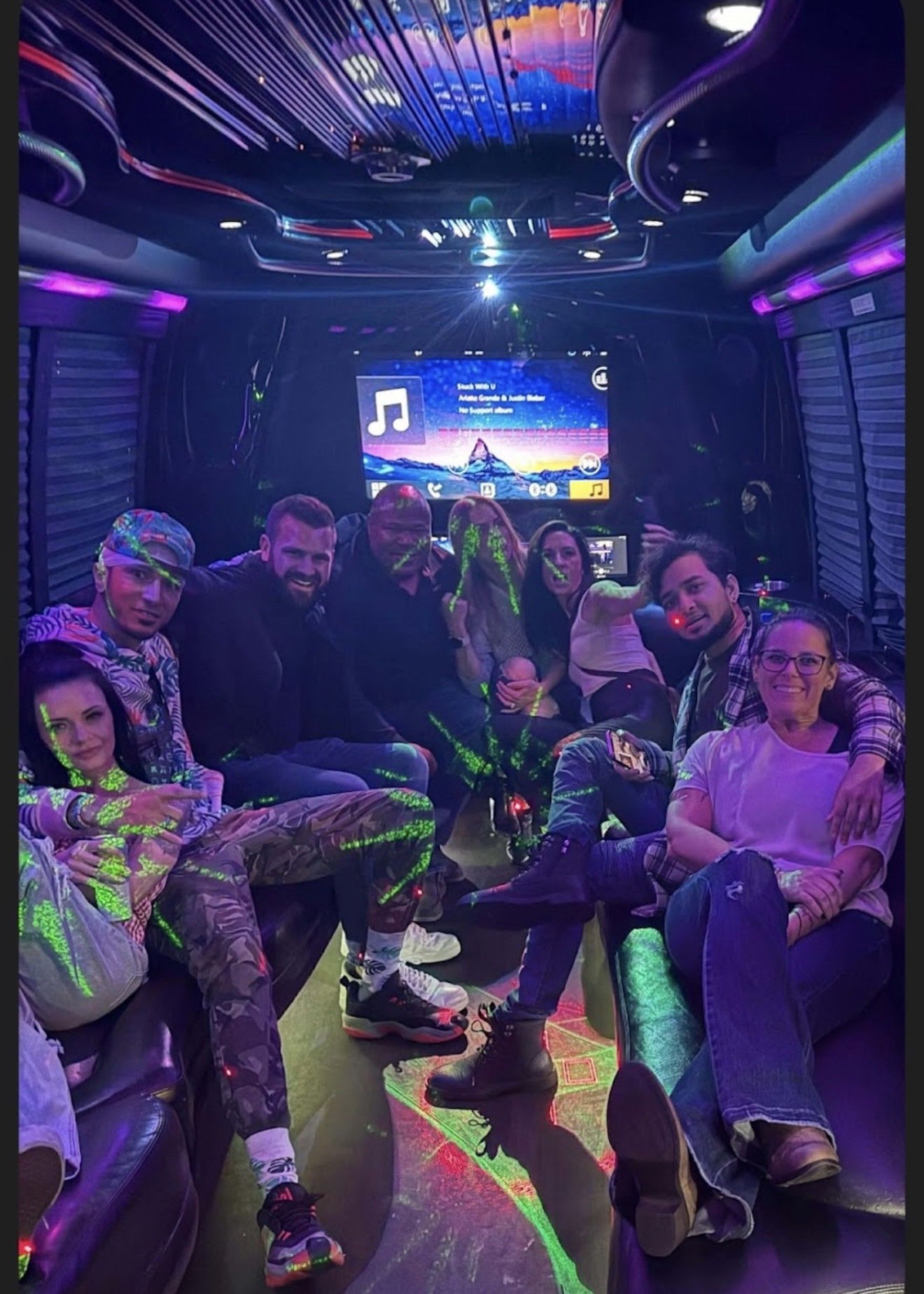 Friends celebrating inside a Play-It-Safe party bus