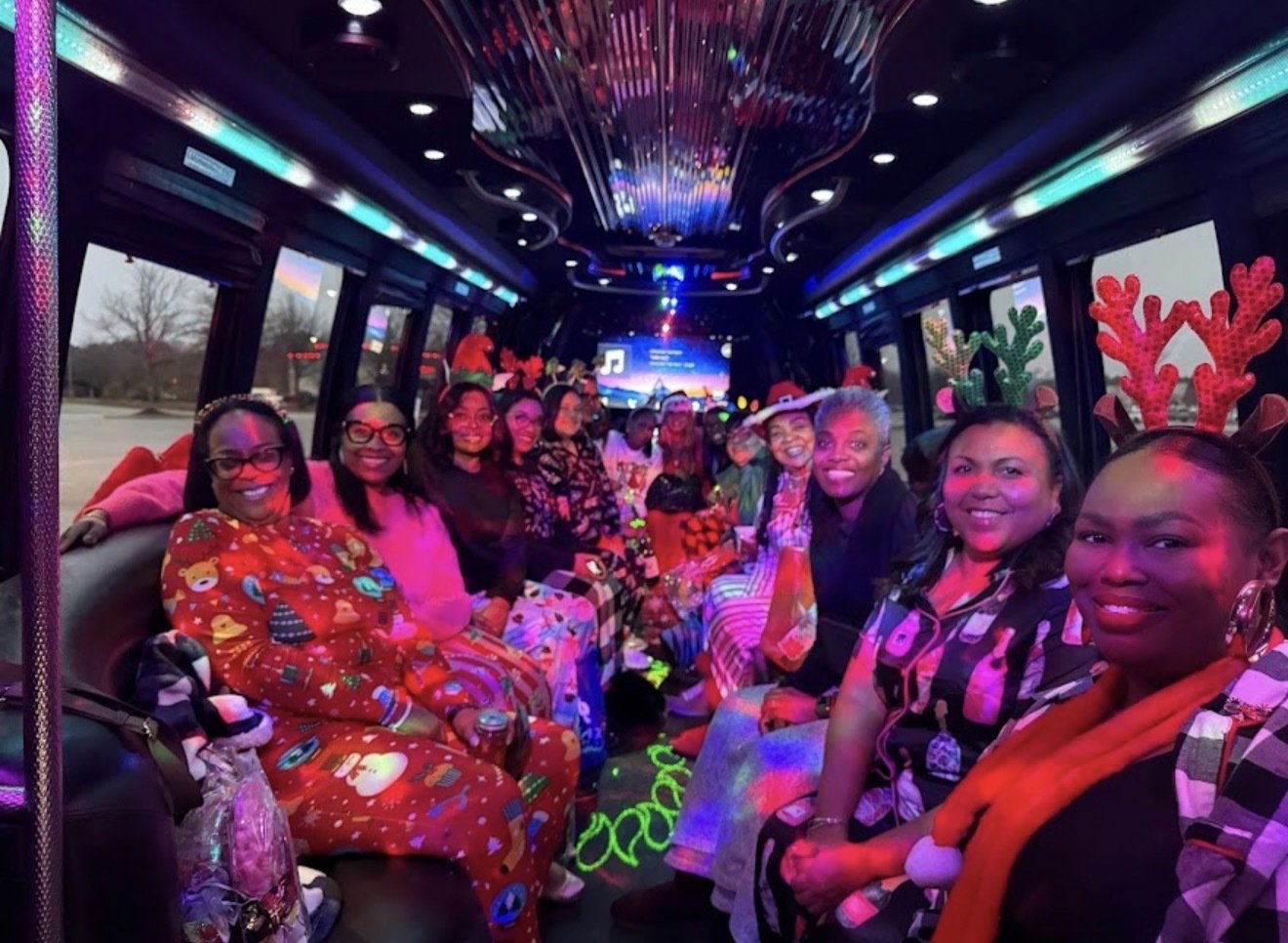 Holiday group celebrating aboard a Play-It-Safe party bus