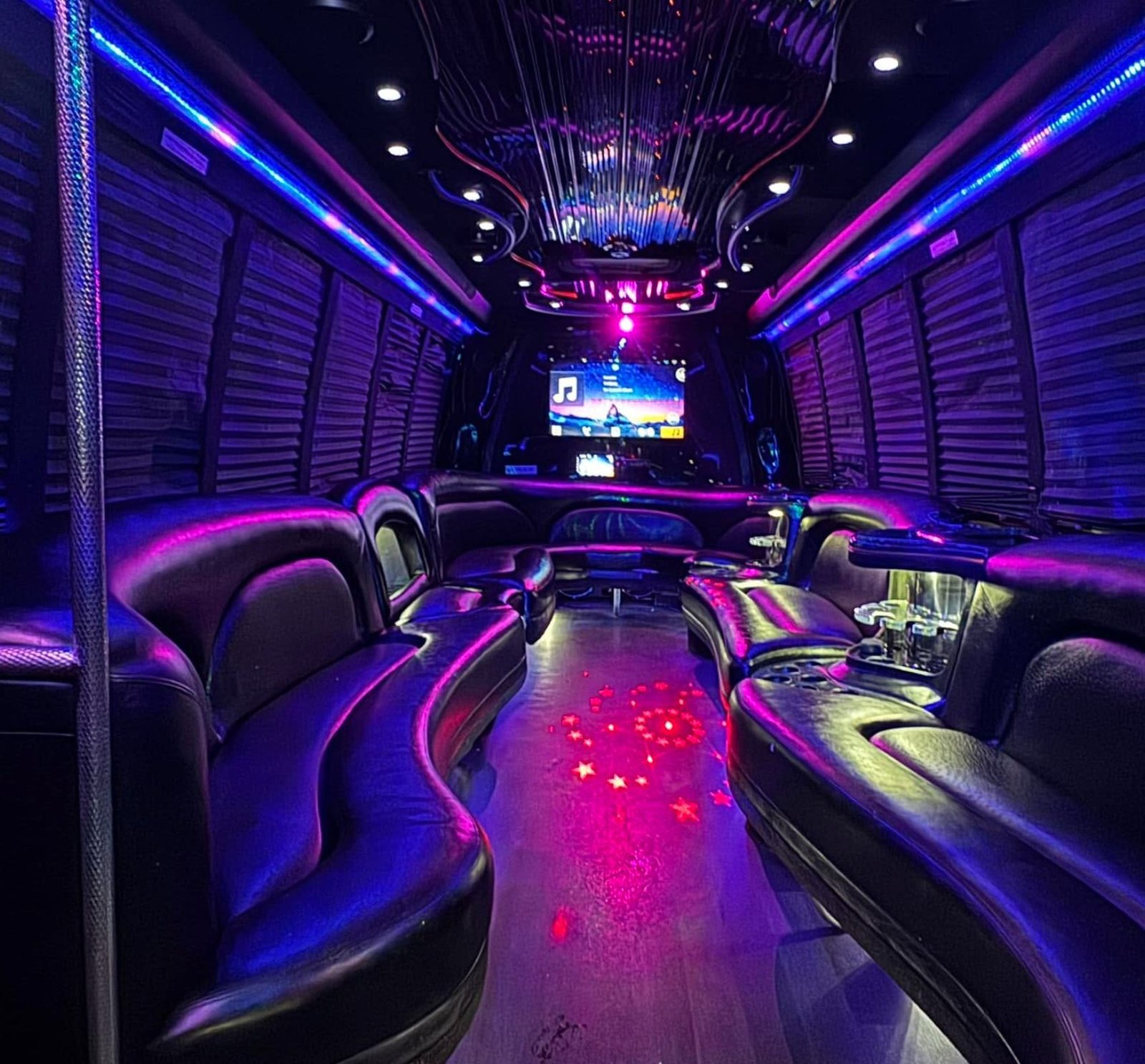Luxury party bus interior with purple lighting