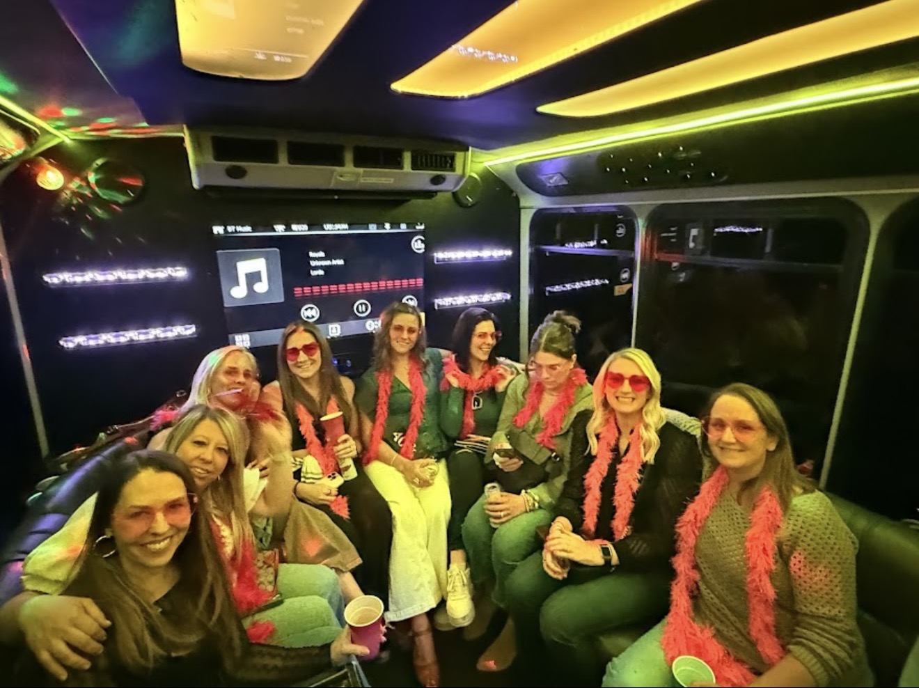 Guests celebrating aboard a Play-It-Safe party bus in Atlanta