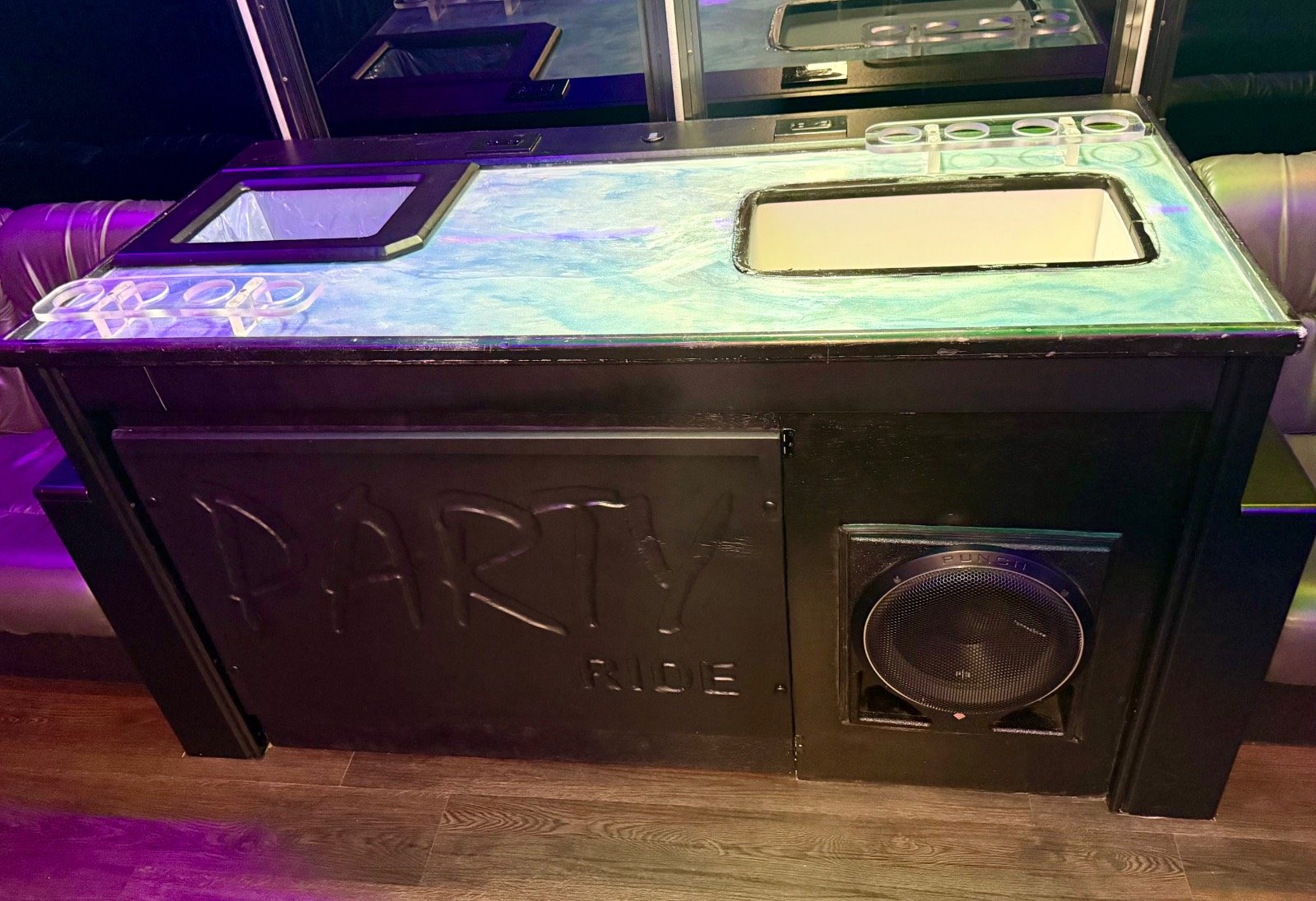 18-passenger Play-It-Safe party bus onboard bar with built-in subwoofer