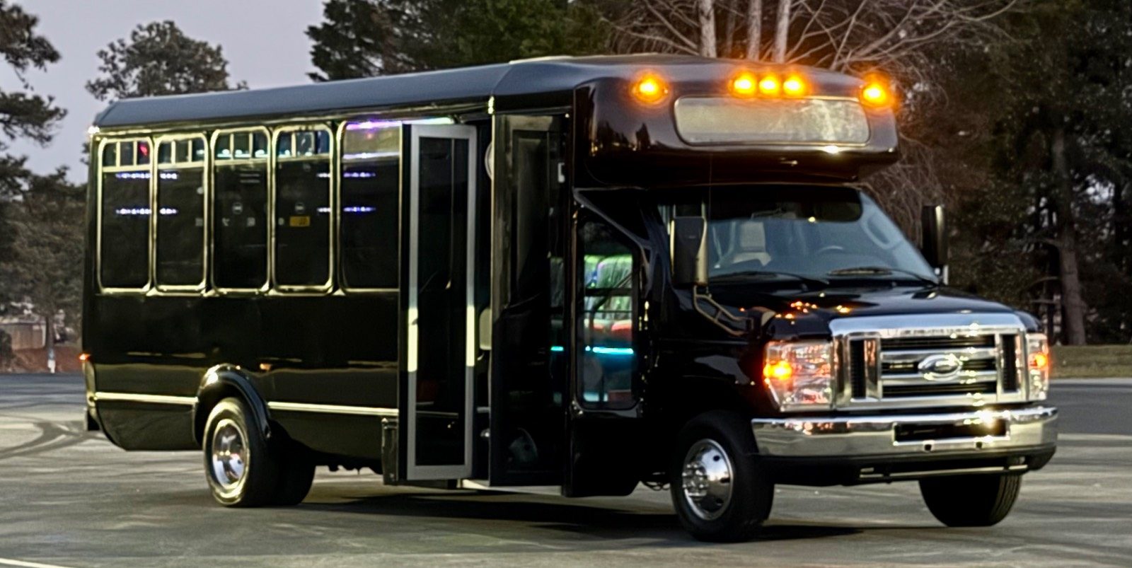 18-passenger Play-It-Safe party bus exterior at dusk