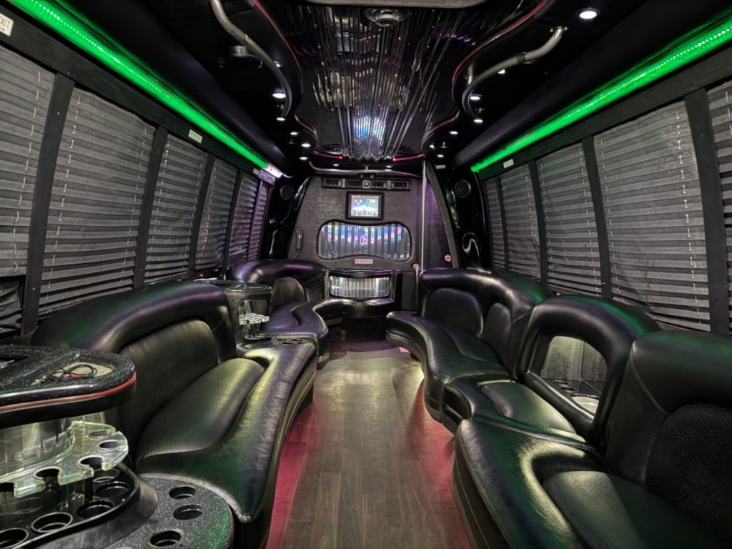 26-passenger party bus interior with green lighting