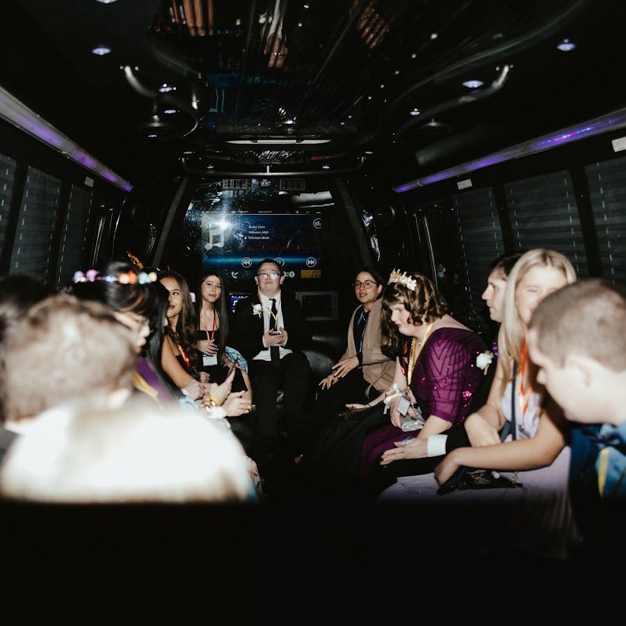 Guests celebrating inside a luxury party bus