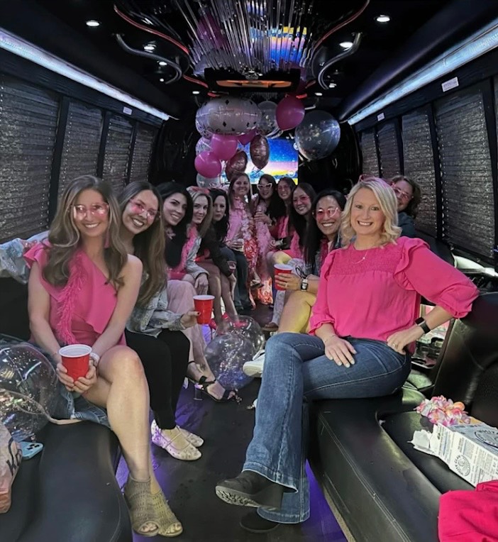 Guests celebrating inside a Play-It-Safe party bus
