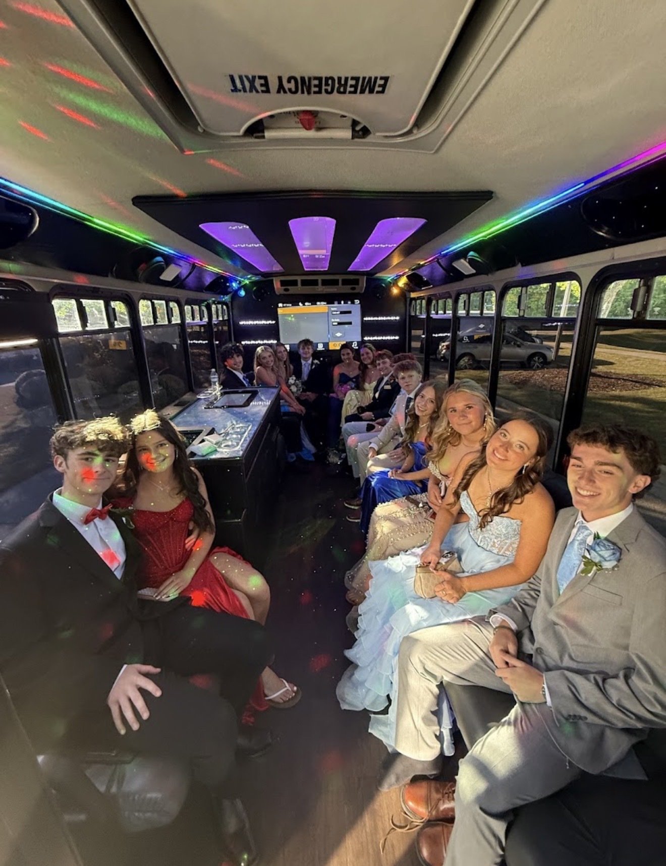 Prom group celebrating aboard a Play-It-Safe party bus in Atlanta