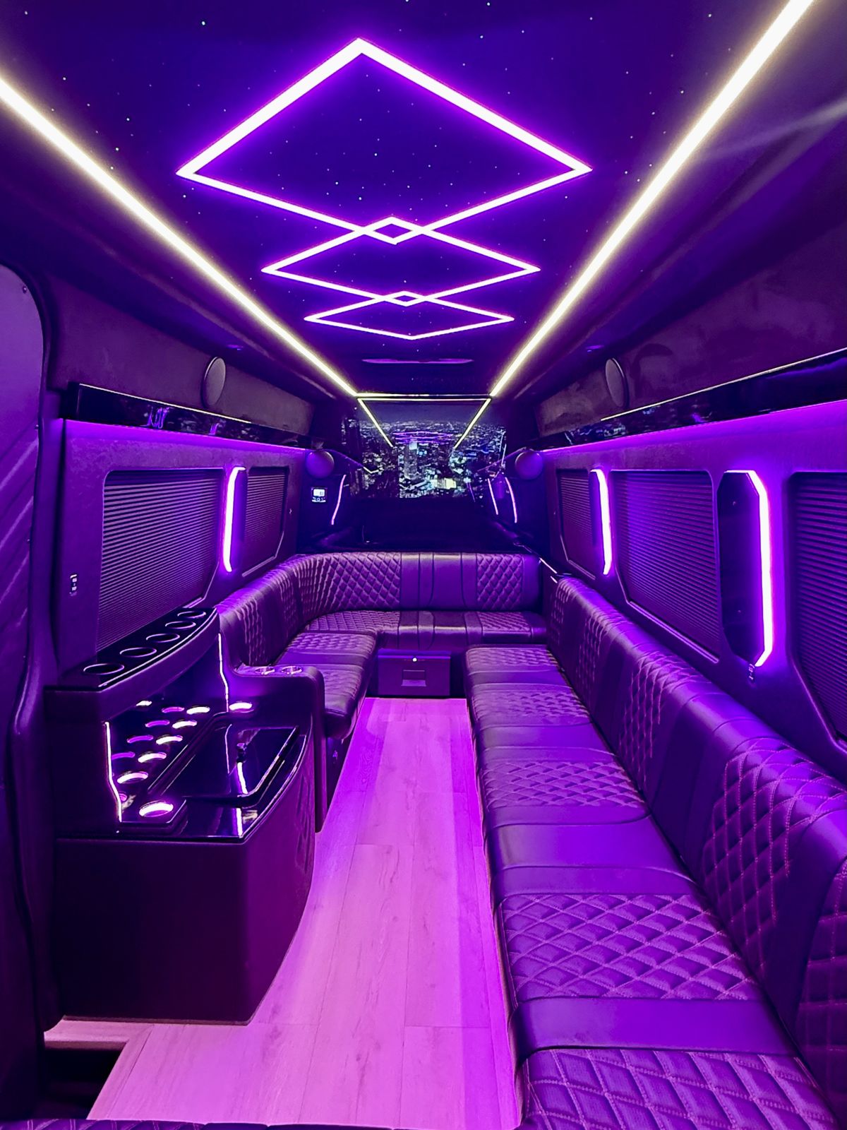 Mercedes Sprinter limo lounge seating, bar and star-light ceiling